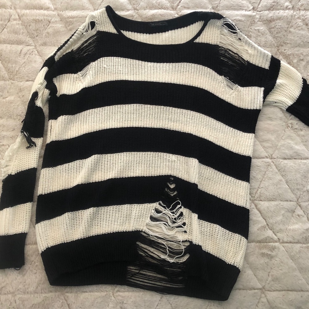Distressed black and white sweater